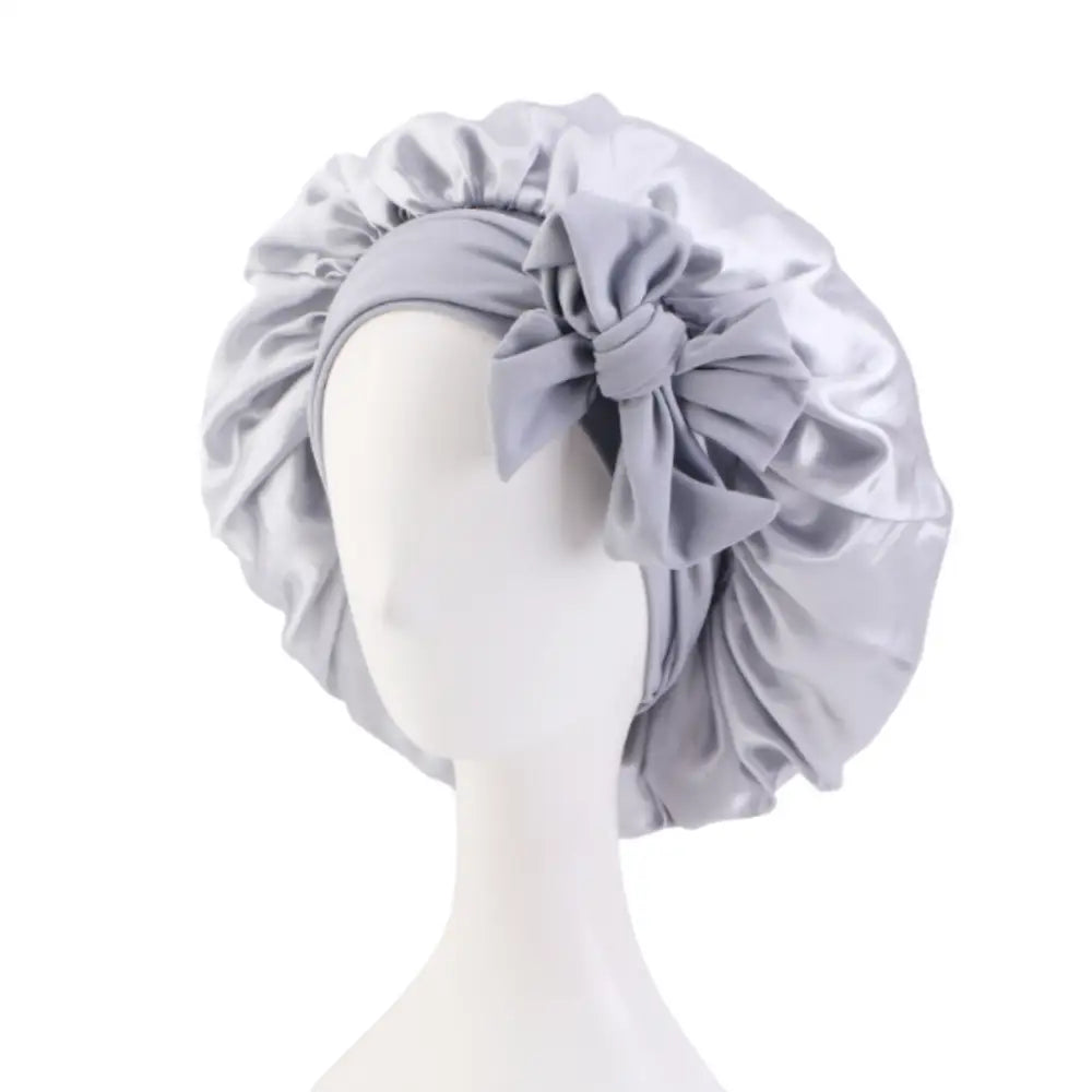 Bonnet en satin pour cheveux bouclés